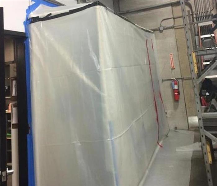 poly containment barrier in a warehouse, high ceilings